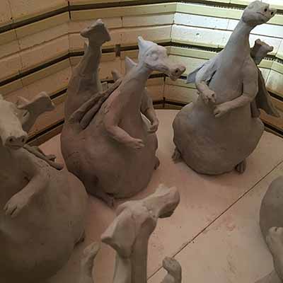 unfired clay dragon sculptures